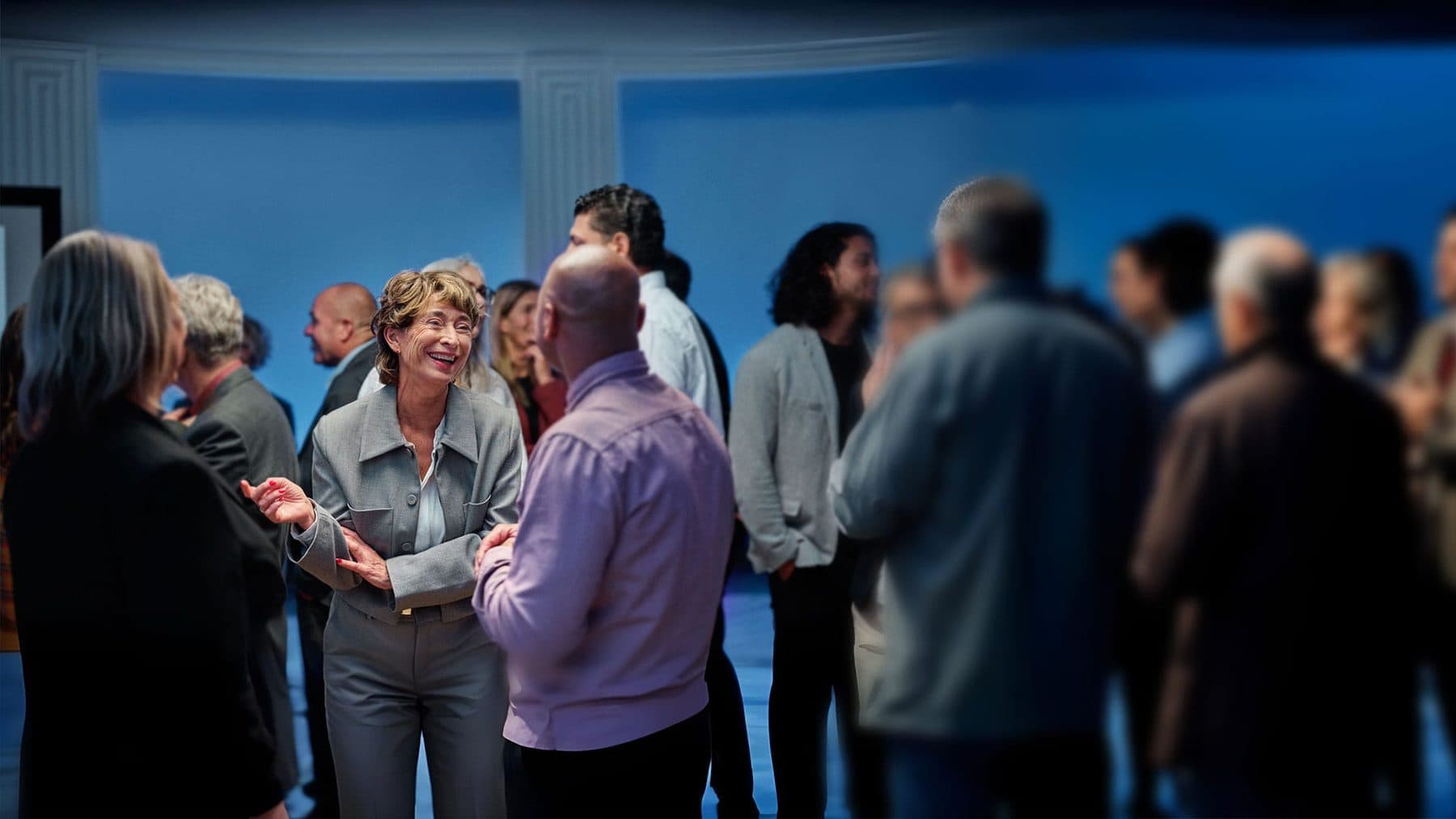 A lively group of friends talking together at an event
