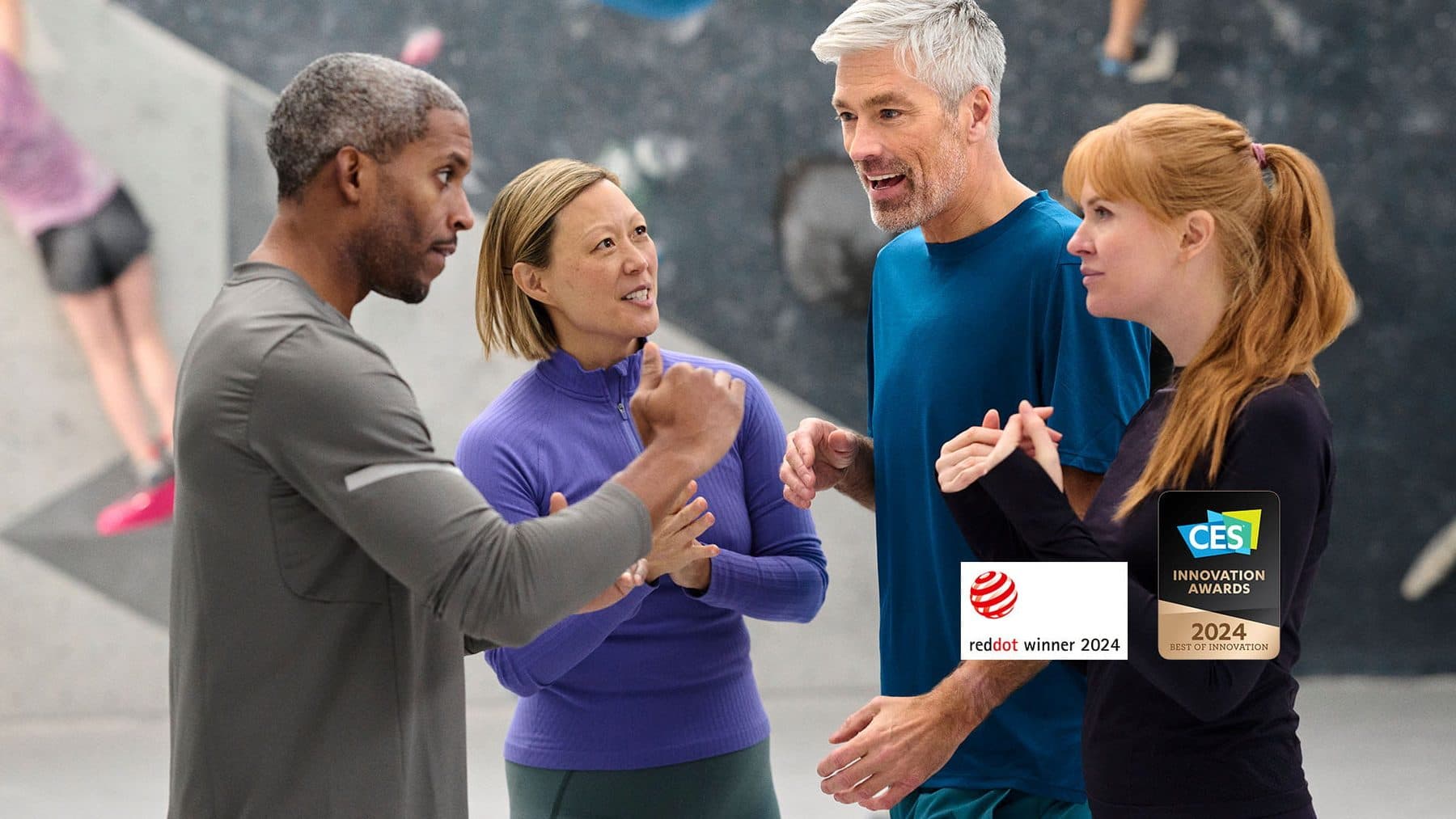 Friends talking together at a bouldering gym