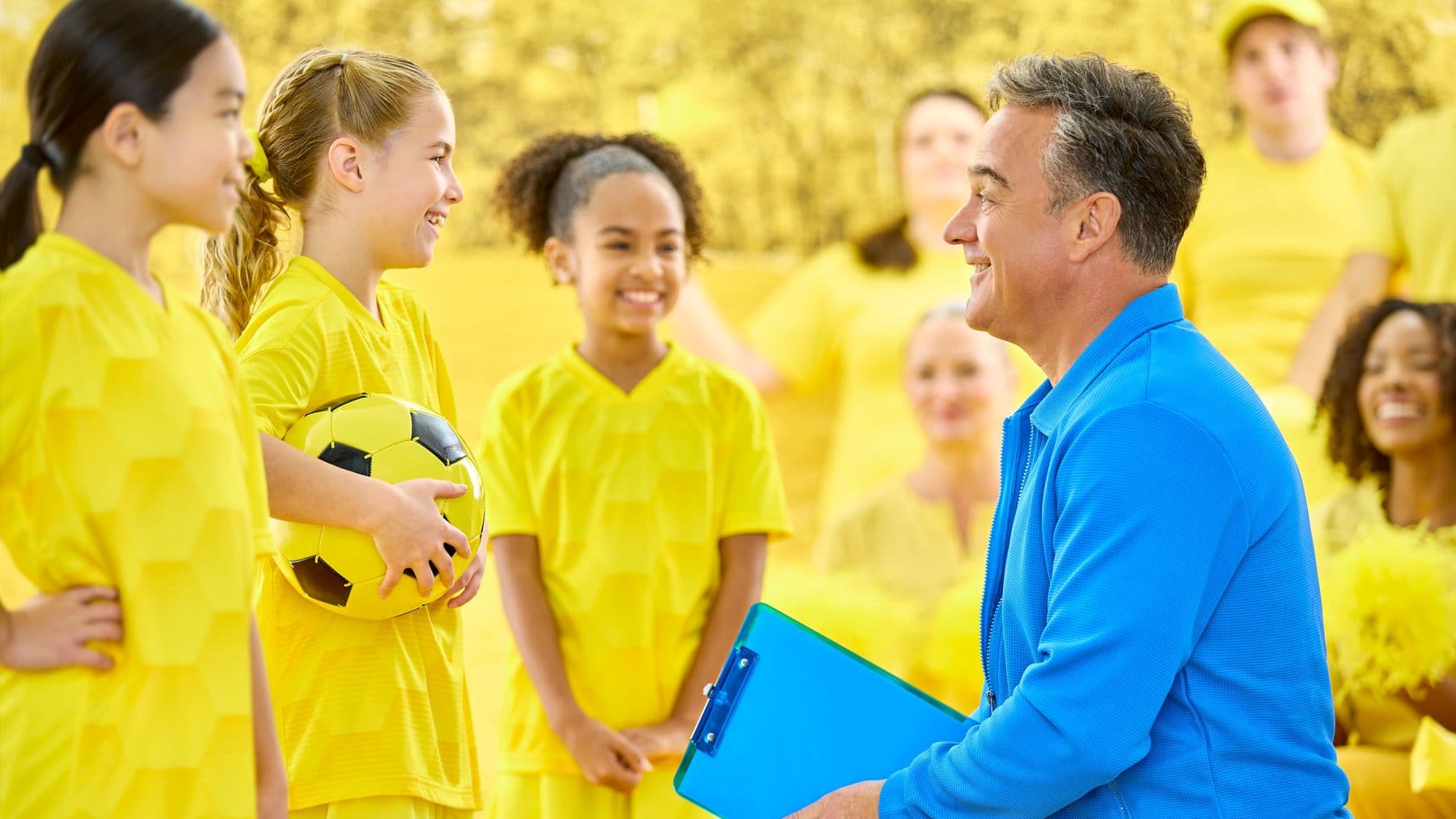 A group of friends enjoying an outdoor game of soccer together